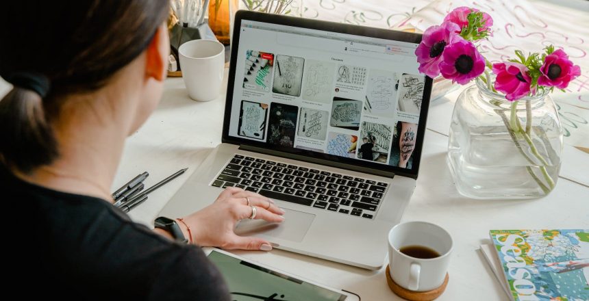 photo of person using laptop for graphic designs